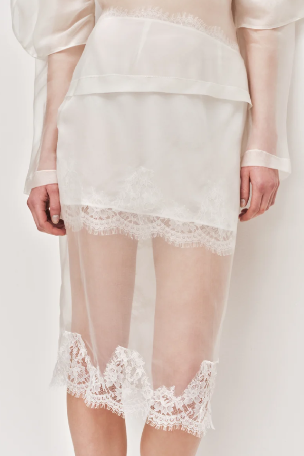 This bias-cut women's skirt is designed with delicate lace trim detailing for an elegant finish. Featuring a zip, hook-and-eye closure and a fully lined silhouette, it offers both comfort and ease of wear.