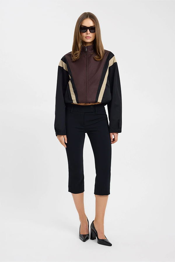 Contemporary and directional, the Spencer Spray Contrast Jacket reworks casual outerwear with bold contrast panelling in rich chocolate, charcoal and warm tan tones. A sharp funnel neck and zip-through front define the cropped, boxy silhouette, while a drawstring hem and buttoned cuffs add a considered, sporty edge.