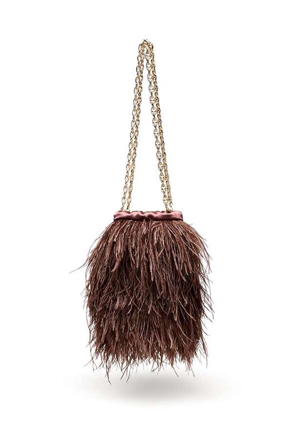 Opulent and unmistakably special, the Feather Bucket Bag is crafted from a lavish caffè coloured ostrich feather exterior that moves with every step. A 62cm brass chain strap and Scanlan Theodore logo bar bring polished structure, while the internal slip pocket carries an embroidered logo. A satin lining completes its evening sensibility. Wear with the Feather Cascade or Feather T-Bar to let the plumage take the evening.