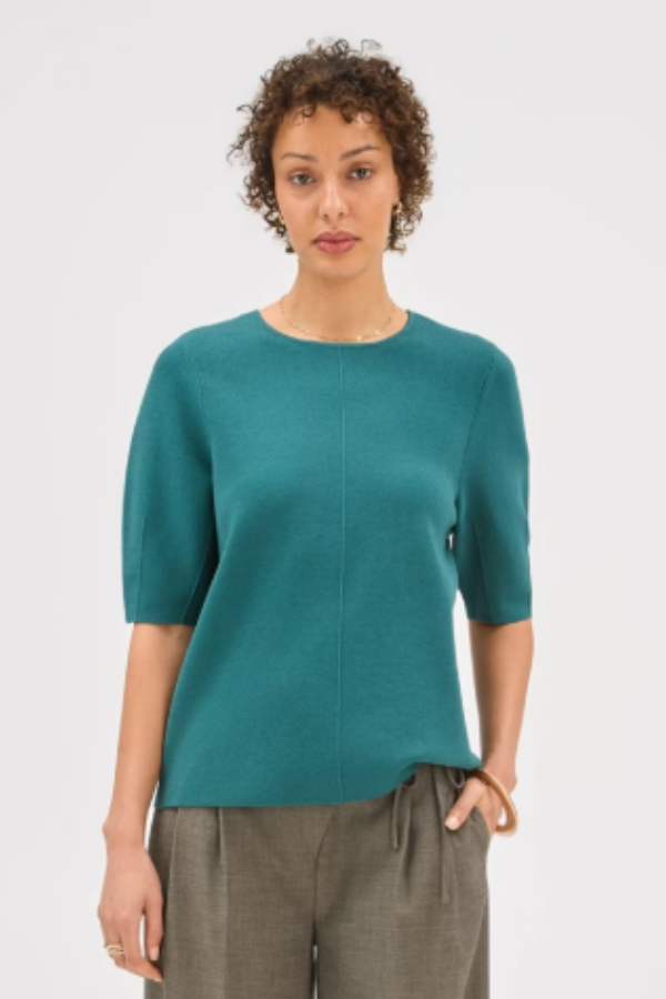Discover the perfect mix of comfort and modern design with the Preview Lantern Short Sleeve Crepe Knit Top. The textured crepe knit fabric gives this top a stylish edge, while the lantern-style short raglan sleeves and ribbed crew neckline offer a hint of contemporary flair. Its regular fit and straight hem make it easy to style for any occasion, whether you’re heading out with friends or enjoying quiet moments. The soft touch of the fabric keeps you feeling great all day long.