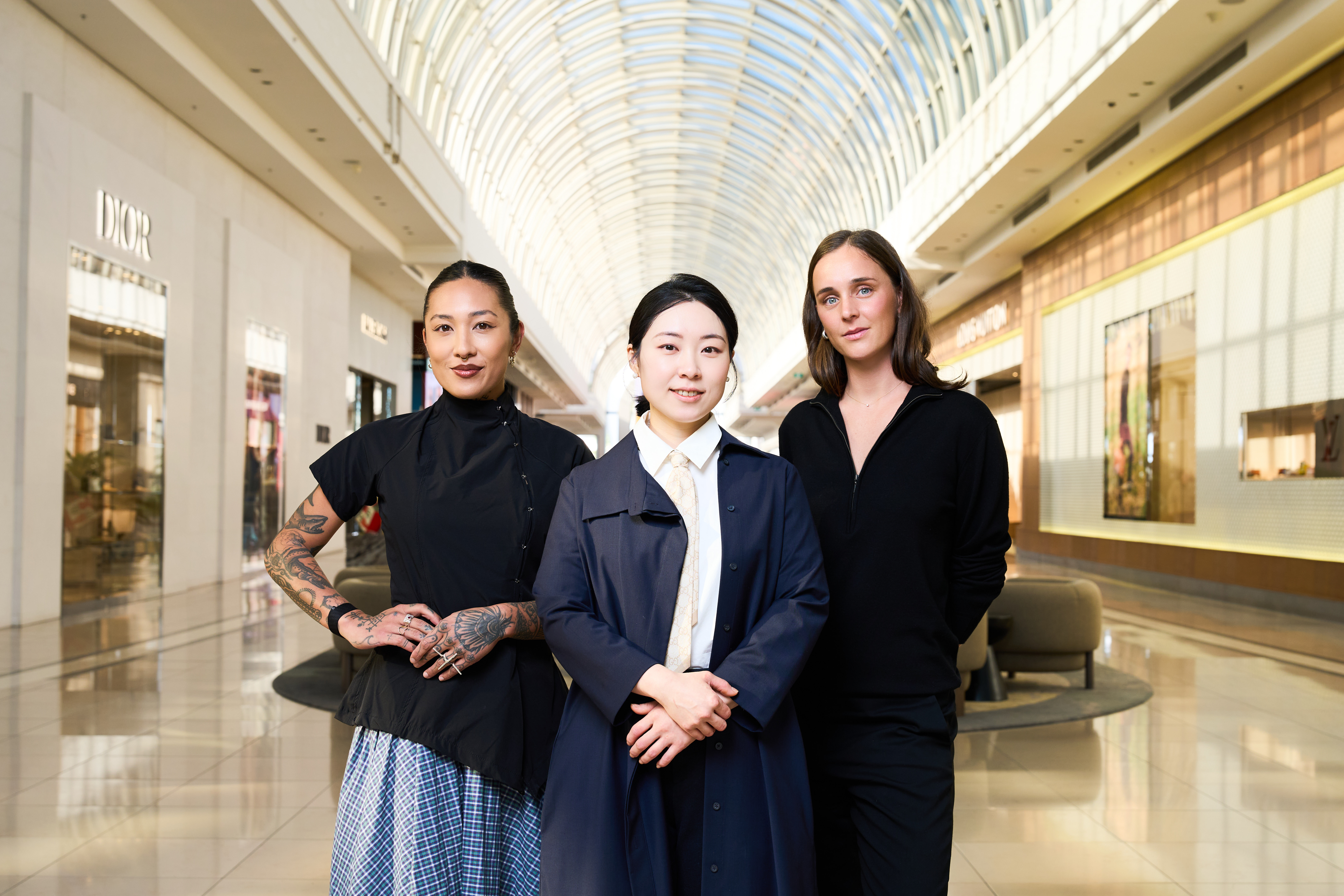 World's Longest Dinner chefs, Nat Thaipun, HyoJu Park, and Audrey Shaw stand in the luxury precinct