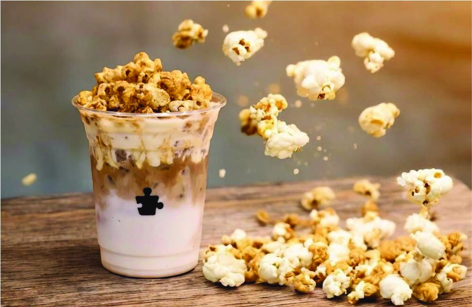 Puzzle Coffee | Iced Popcorn Latte: A Cinematic Chill