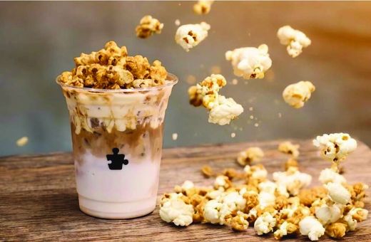 Puzzle Coffee | Iced Popcorn Latte: A Cinematic Chill