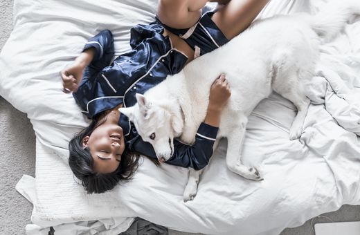 Girl in pajamas with dog