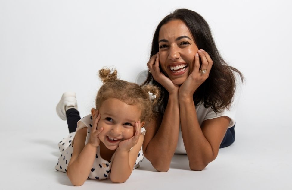 Mother and daughter laughing.