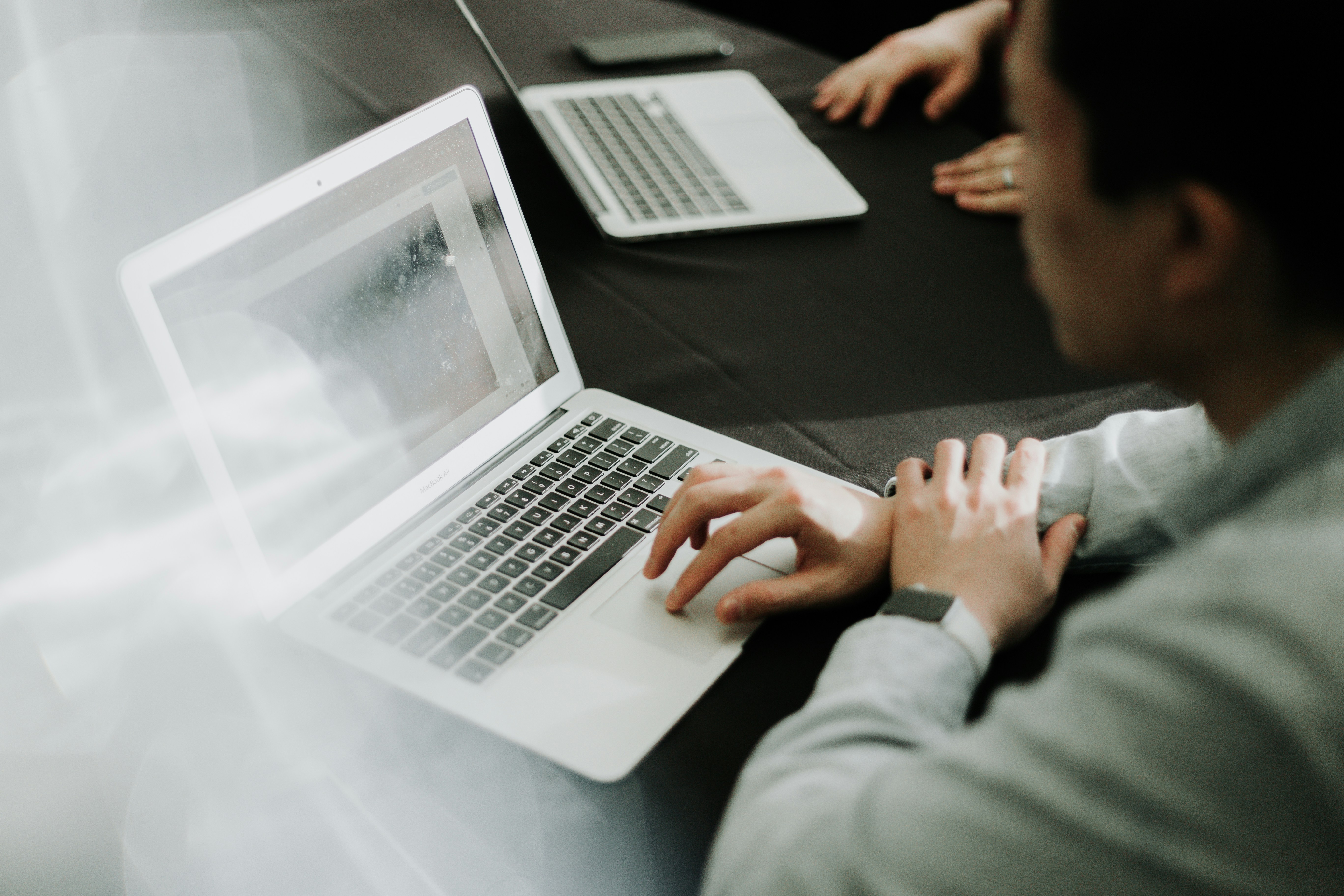 Operations manager reviewing workforce plans on a laptop