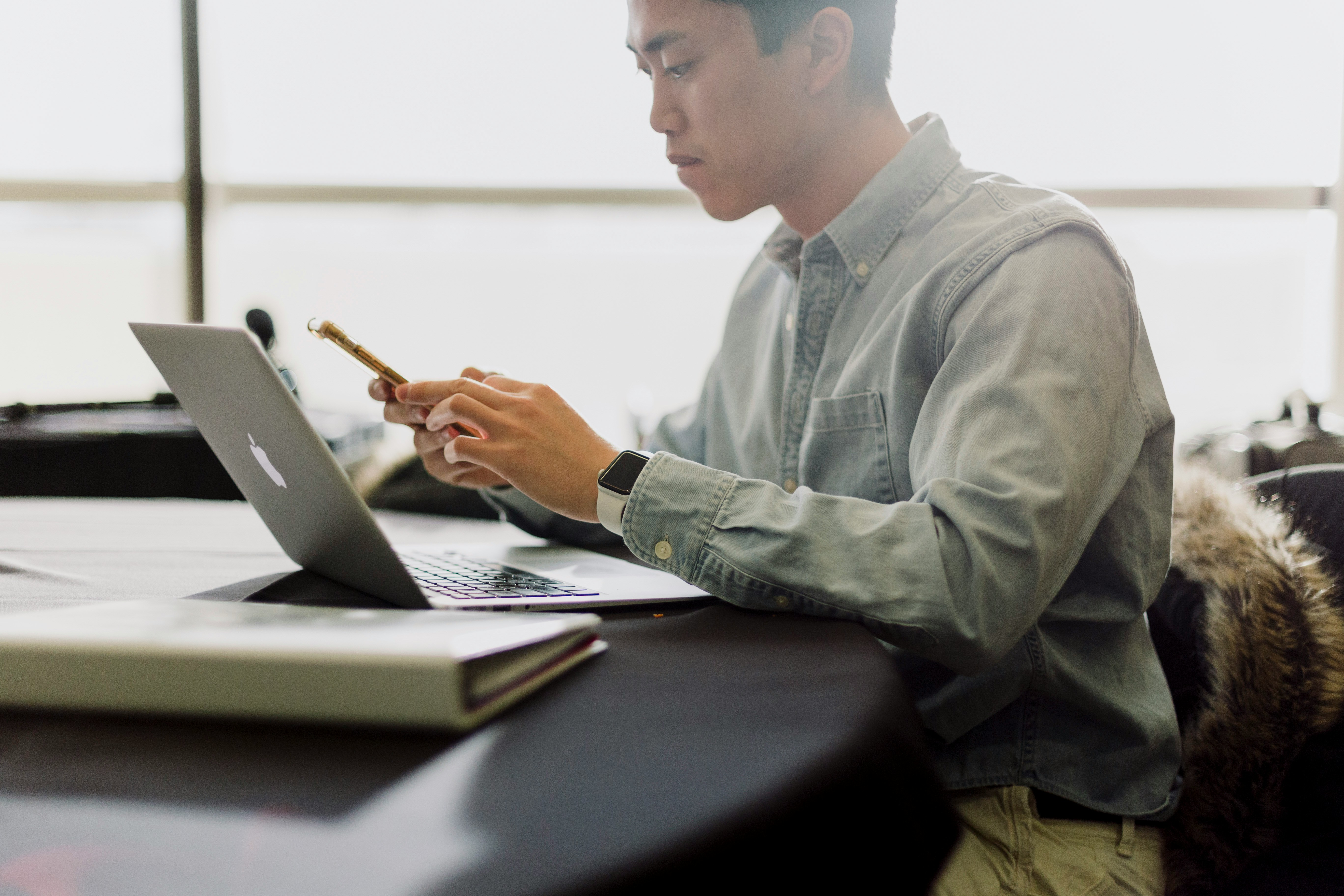 Manager reviewing hours and schedules on a laptop at work