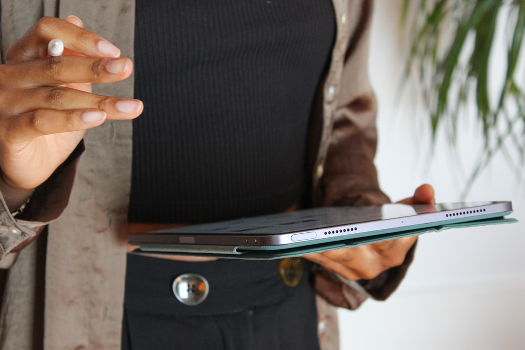 Manager reviewing staff schedules on a tablet