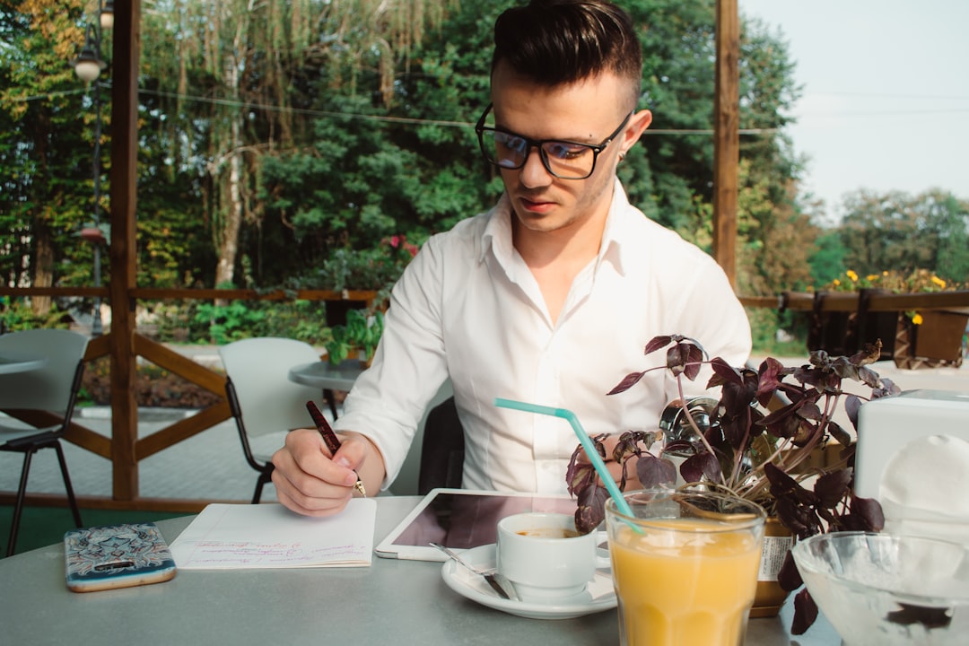 Restaurant manager calculating labour costs while planning staff coverage