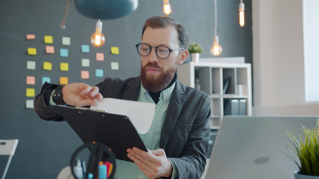 Manager reviewing employee hours and rest-period compliance reports