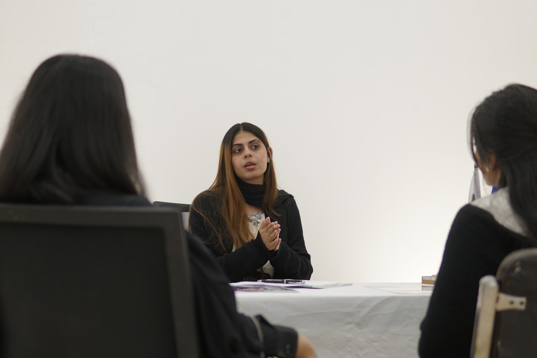 Private HR meeting discussing a workplace complaint and reporting process