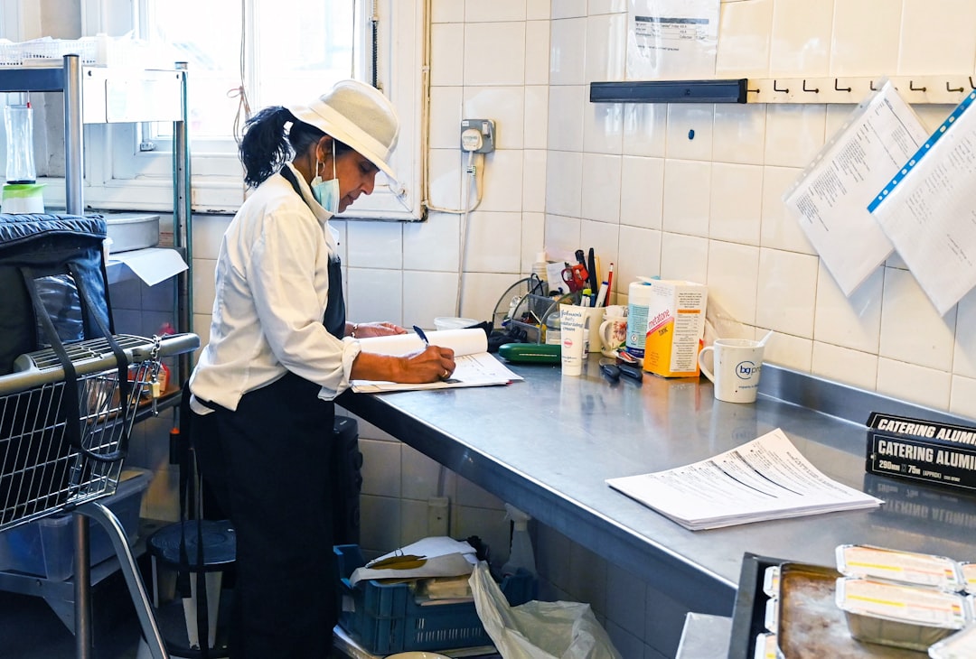 Chef completing a kitchen cleaning checklist during a shift