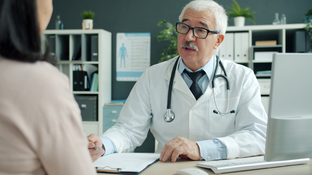 Patient meeting with a primary care doctor during an HMO consultation