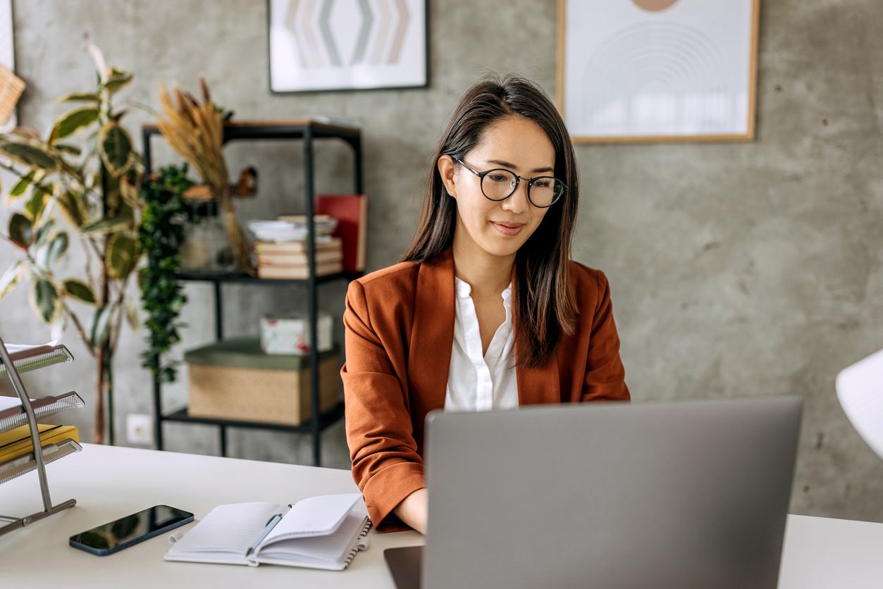 businesswoman working on laptop in office
