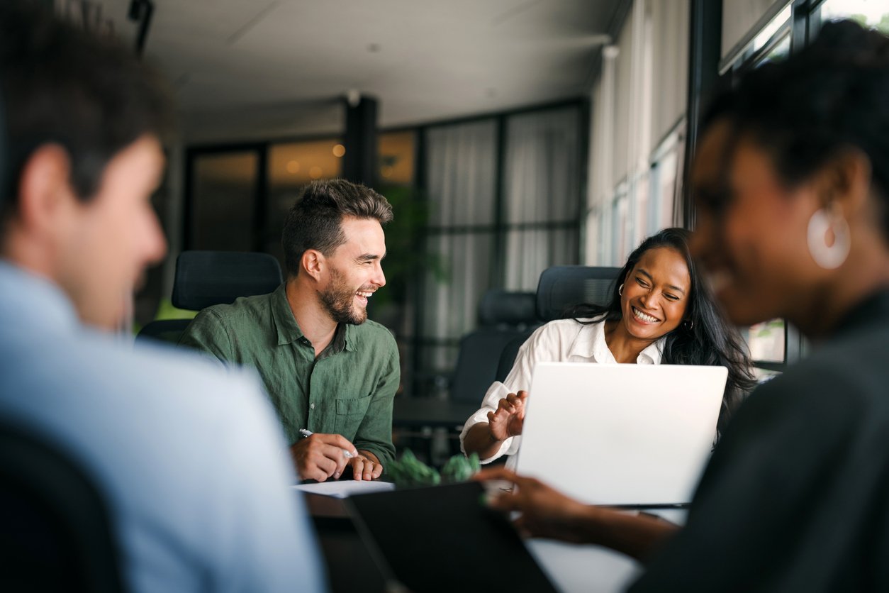 roup of young multi-ethnic startup business team collaborating on project in modern office stock photo