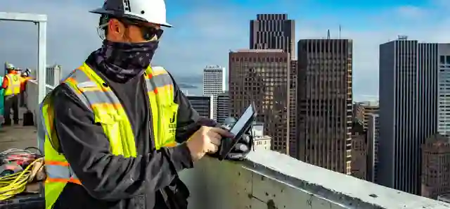 construction-worker-skyscraper-rooftop