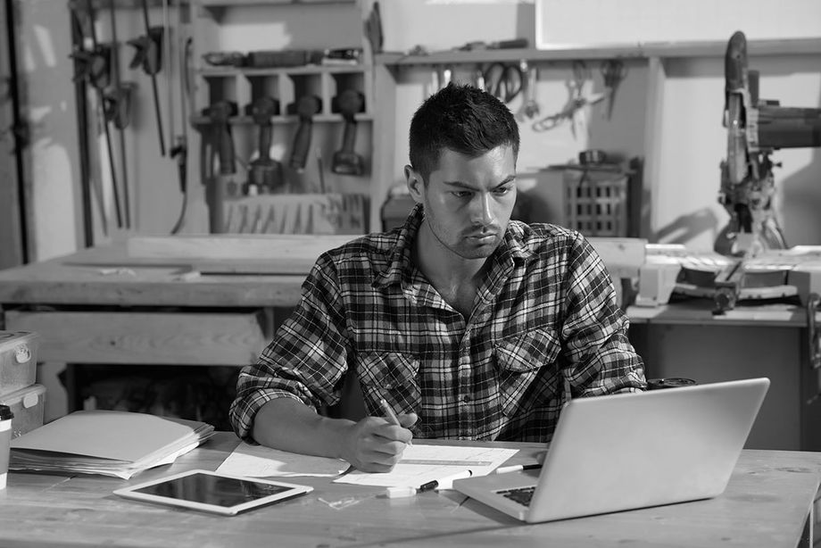 Small business owner works on credit reports