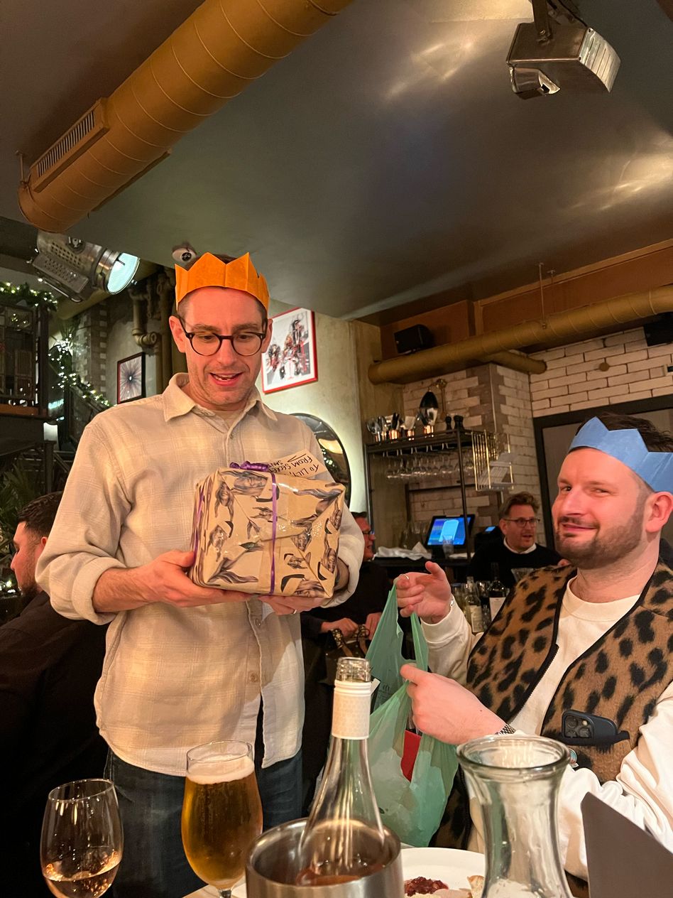 Santa Jamie handing out the gifts