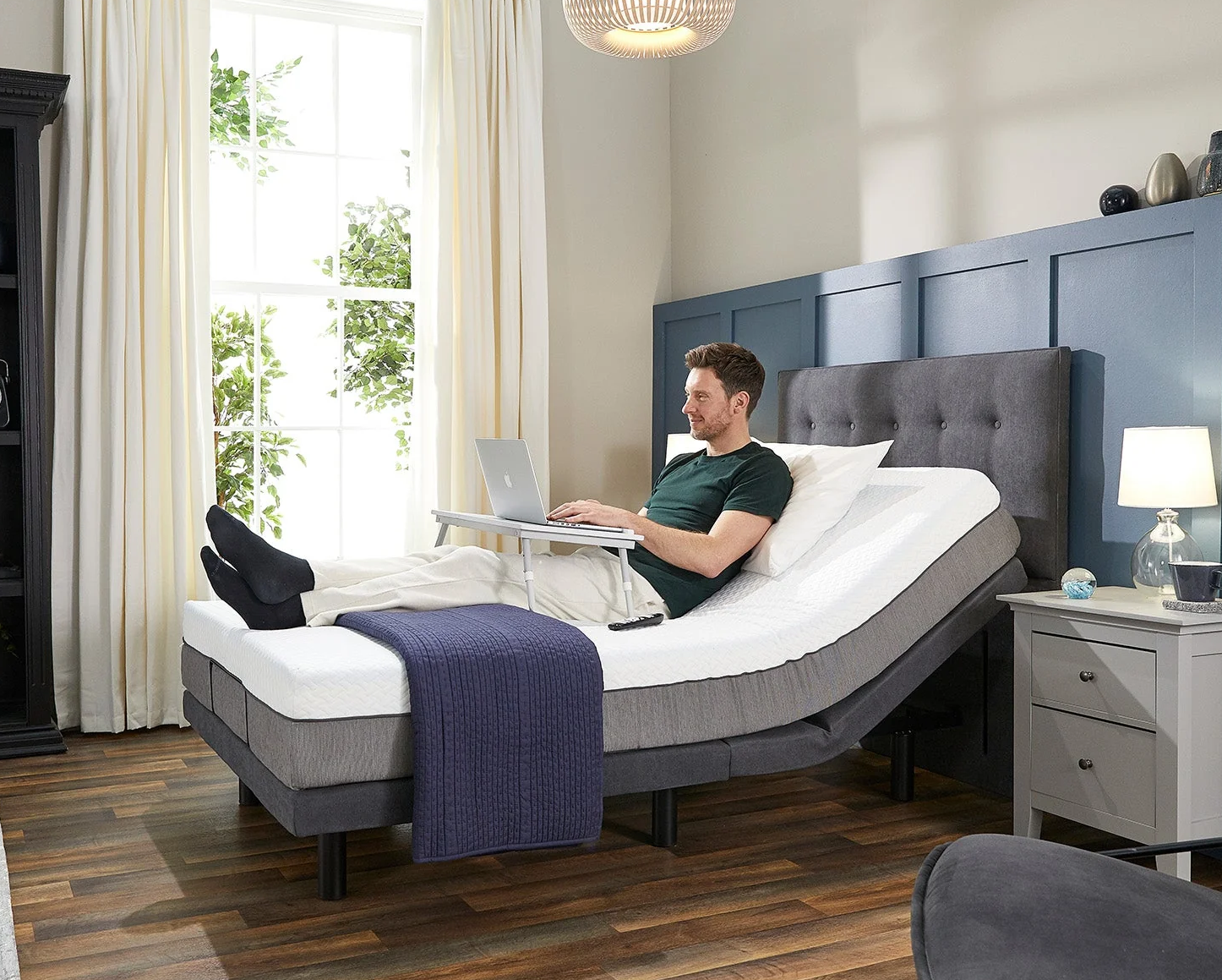 Man relaxing on the Opera Emerald Motion Adjustable Bed