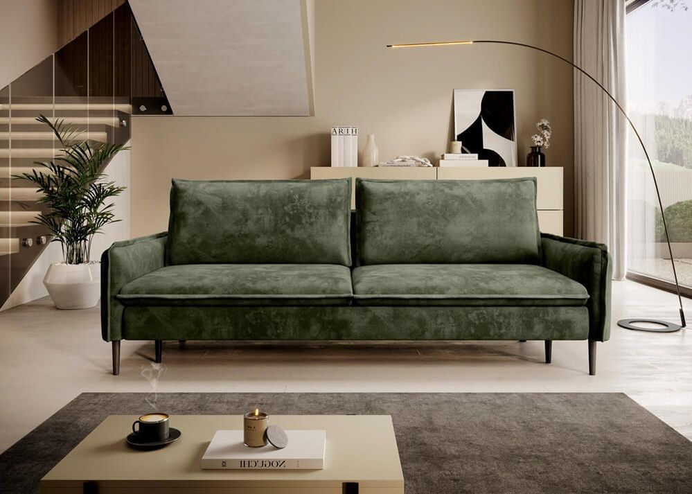 Schlicht gestaltetes, grünes Schlafsofa vor heller Wand mit modernem Design und geradliniger Form.