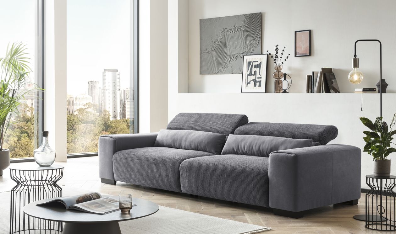 graues cord Bigsofa in modernem Zimmer