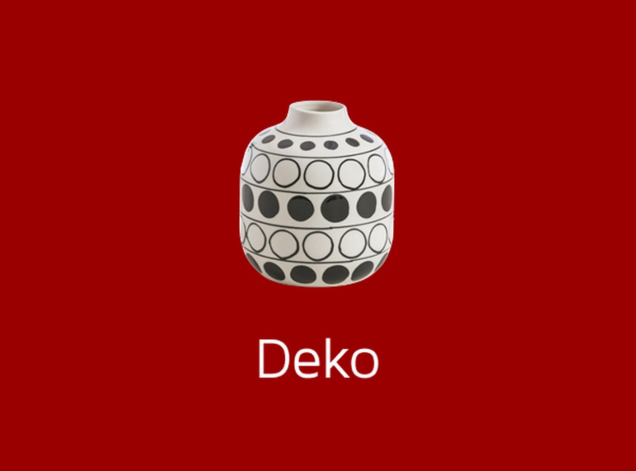 Weiße Vase mit schwarzen Kreisen auf rotem Hintergrund, darunter das Wort "Deko".