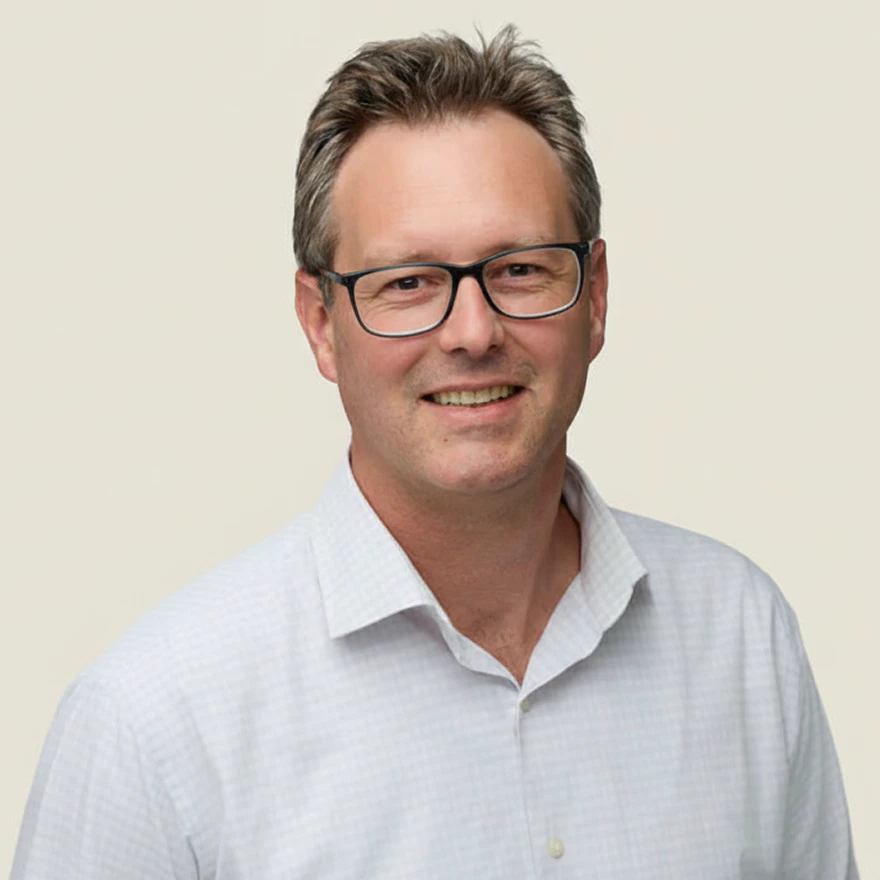 Photo of Paul Basson, CRO, with 20+ years in operational, compliance, risk, and governance roles.