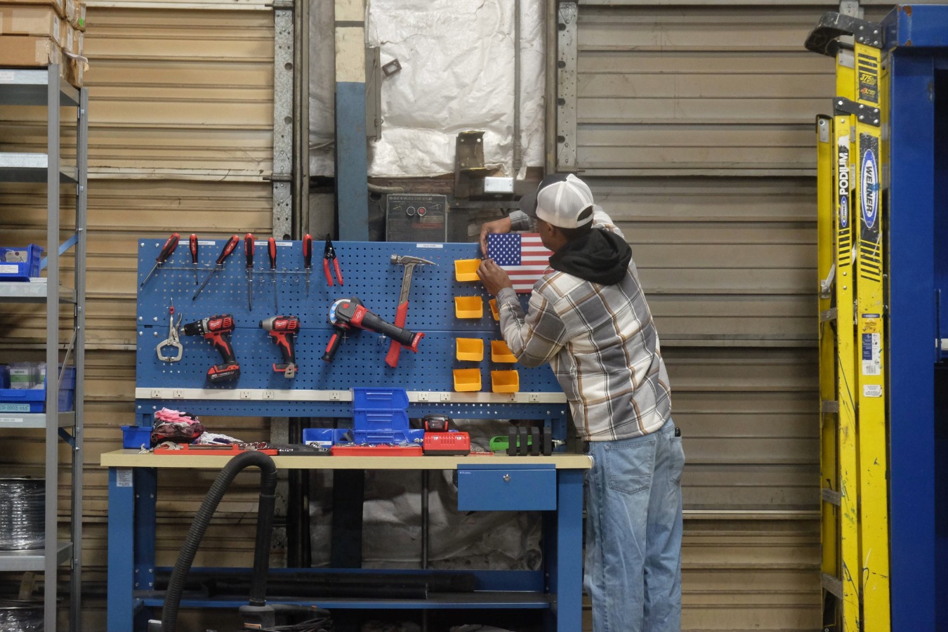 a worker organizing his workbench