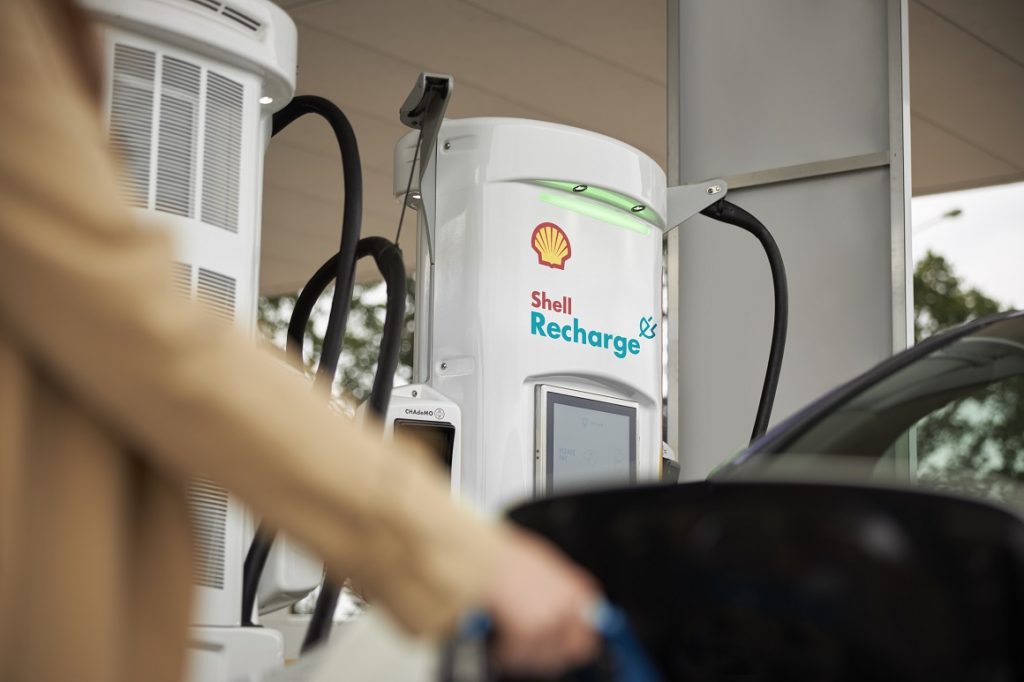 Shell Recharge Station with person charging vehicle