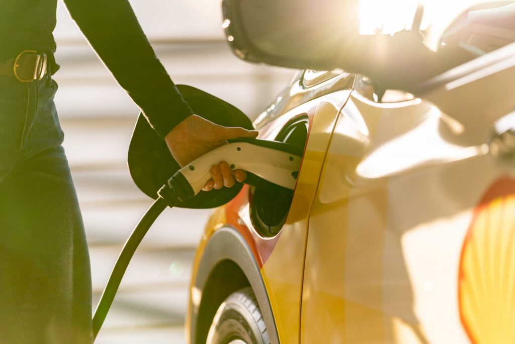 Person charging vehicle