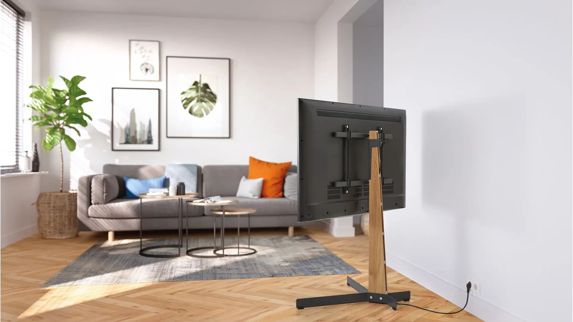 A black TVS floor stand | Vogel's