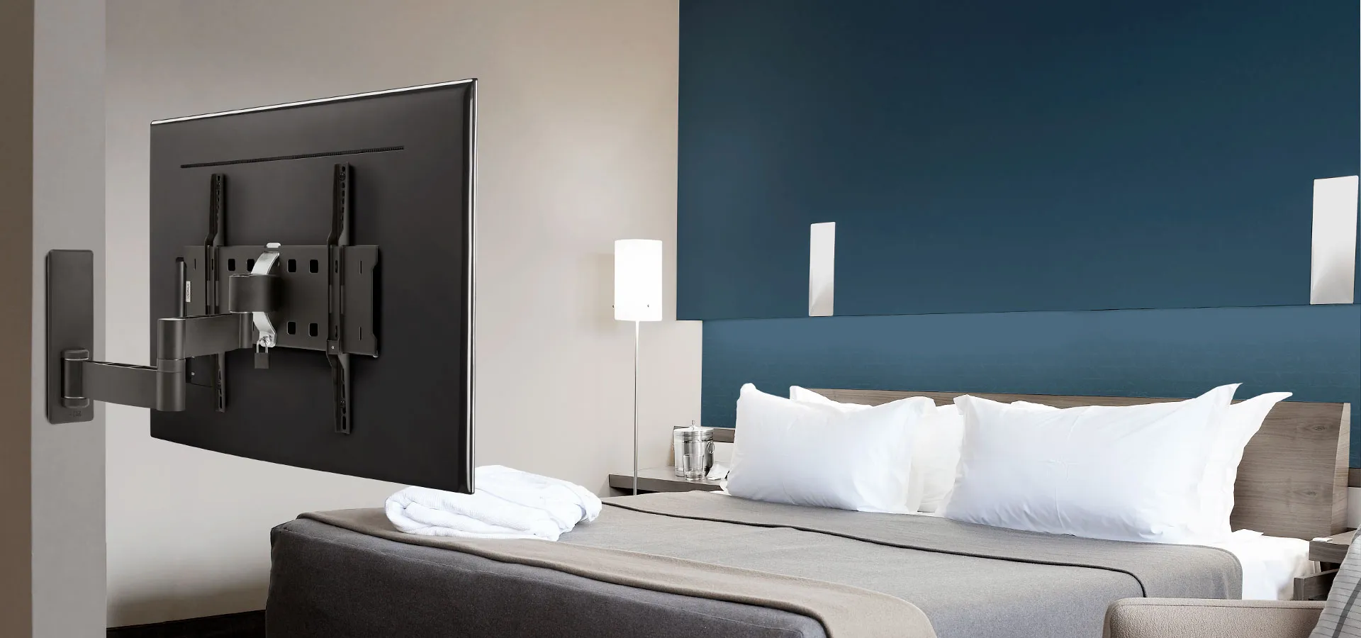 Professional TV wall bracket in hotel room | Vogel's