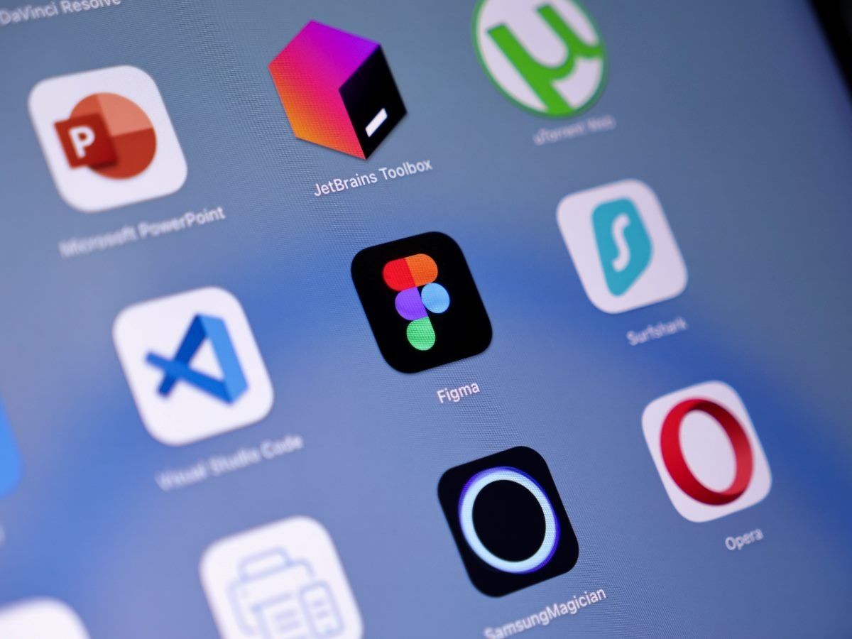 Close-up of a tablet screen displaying various app icons, including PowerPoint, JetBrains Toolbox, Figma, and Opera.
