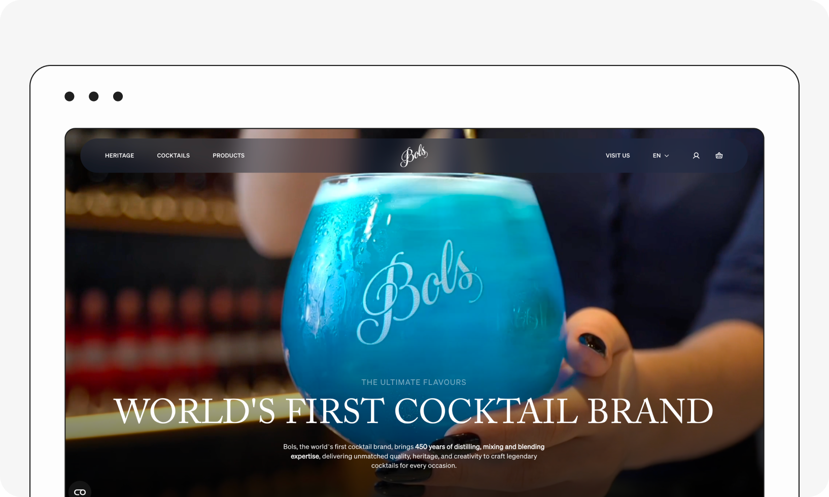 A website screenshot showing a large blue cocktail with the brand name "Bols." The text reads "World's First Cocktail Brand."