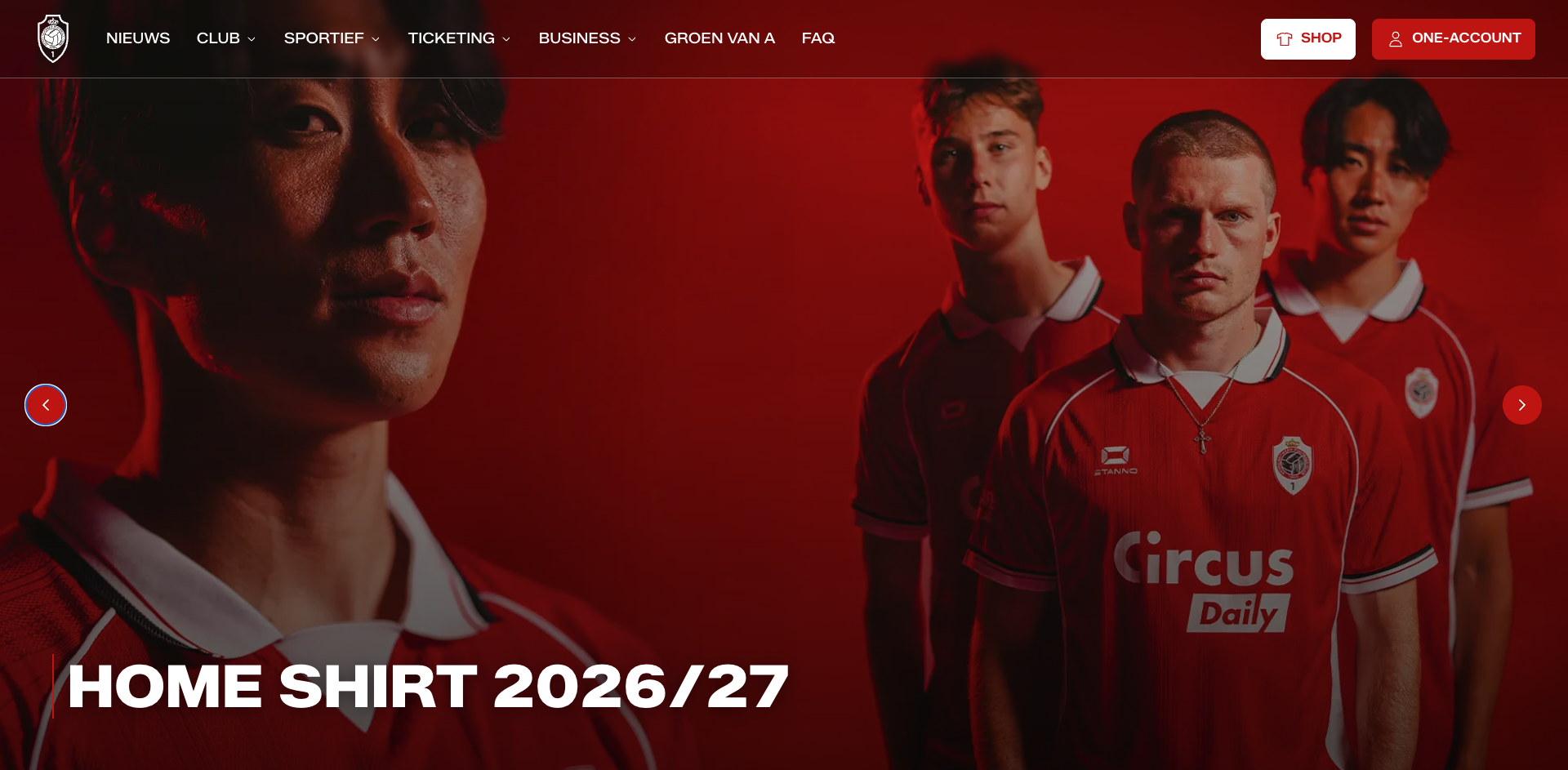 Alt text: "Website banner promoting the 'Home Shirt 2026/27' — four footballers in red team kits with white collars, sponsored by Circus Daily, shown in dramatic red-toned lighting against a dark red background. A navigation menu with NIEUWS, CLUB, SPORTIEF, TICKETING, BUSINESS, GROEN VAN A, and FAQ appears at the top, alongside SHOP and ONE-ACCOUNT buttons.