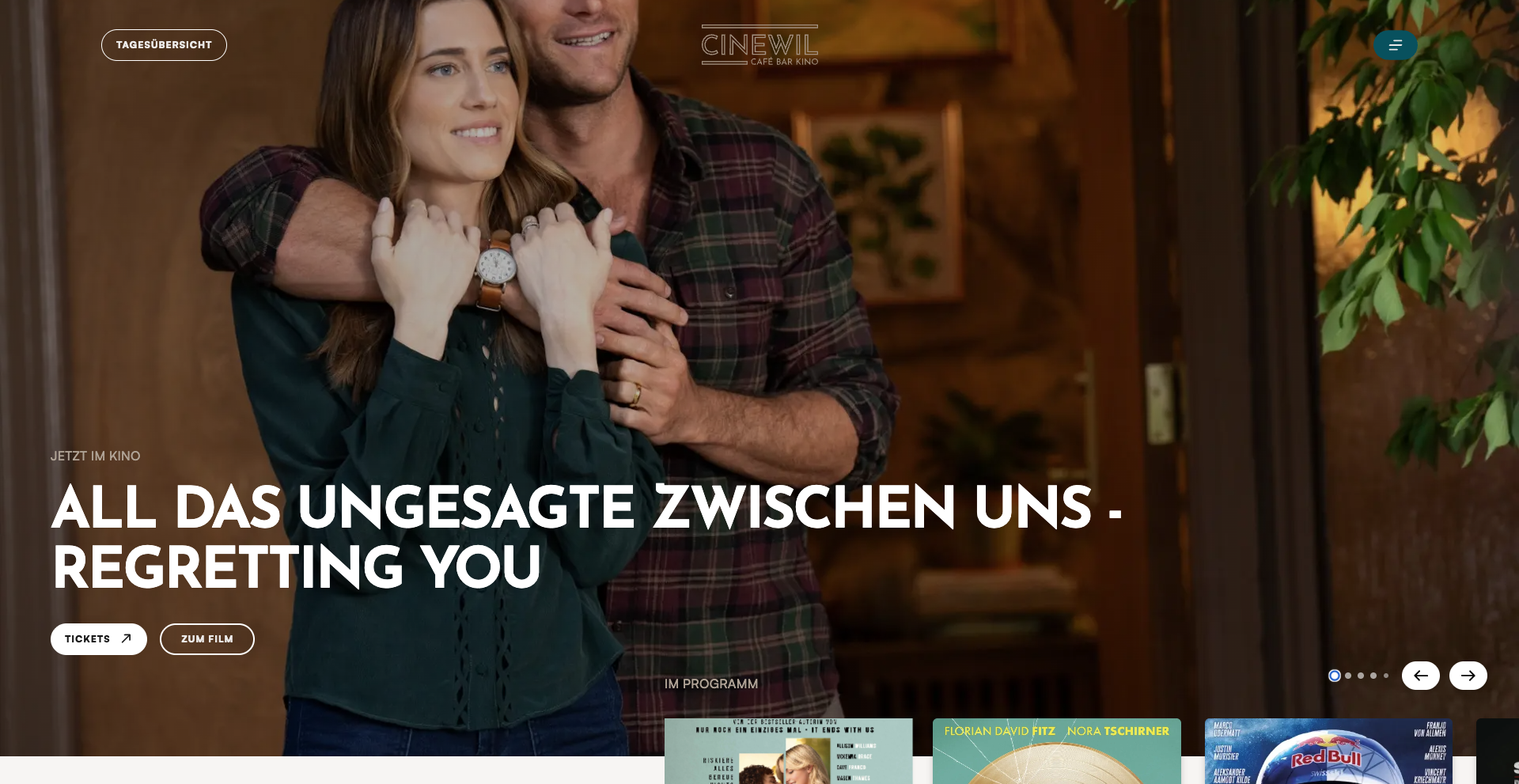 Homepage of Cinewil Café Bar Kino showing a movie promotion for “All Das Ungesagte Zwischen Uns – Regretting You.” The image features a smiling couple embracing, with buttons for tickets and film details, and the Cinewil logo at the top.