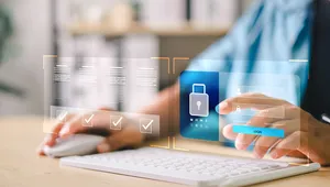 Person using a computer with a virtual interface displaying security icons and login fields, emphasizing cybersecurity.