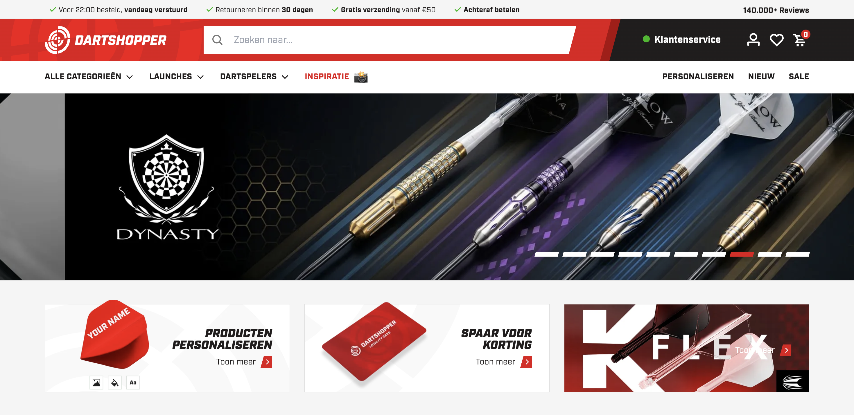 Dartshopper homepage displaying darts with intricate designs, navigation menu, and promotional banners for products and discounts.