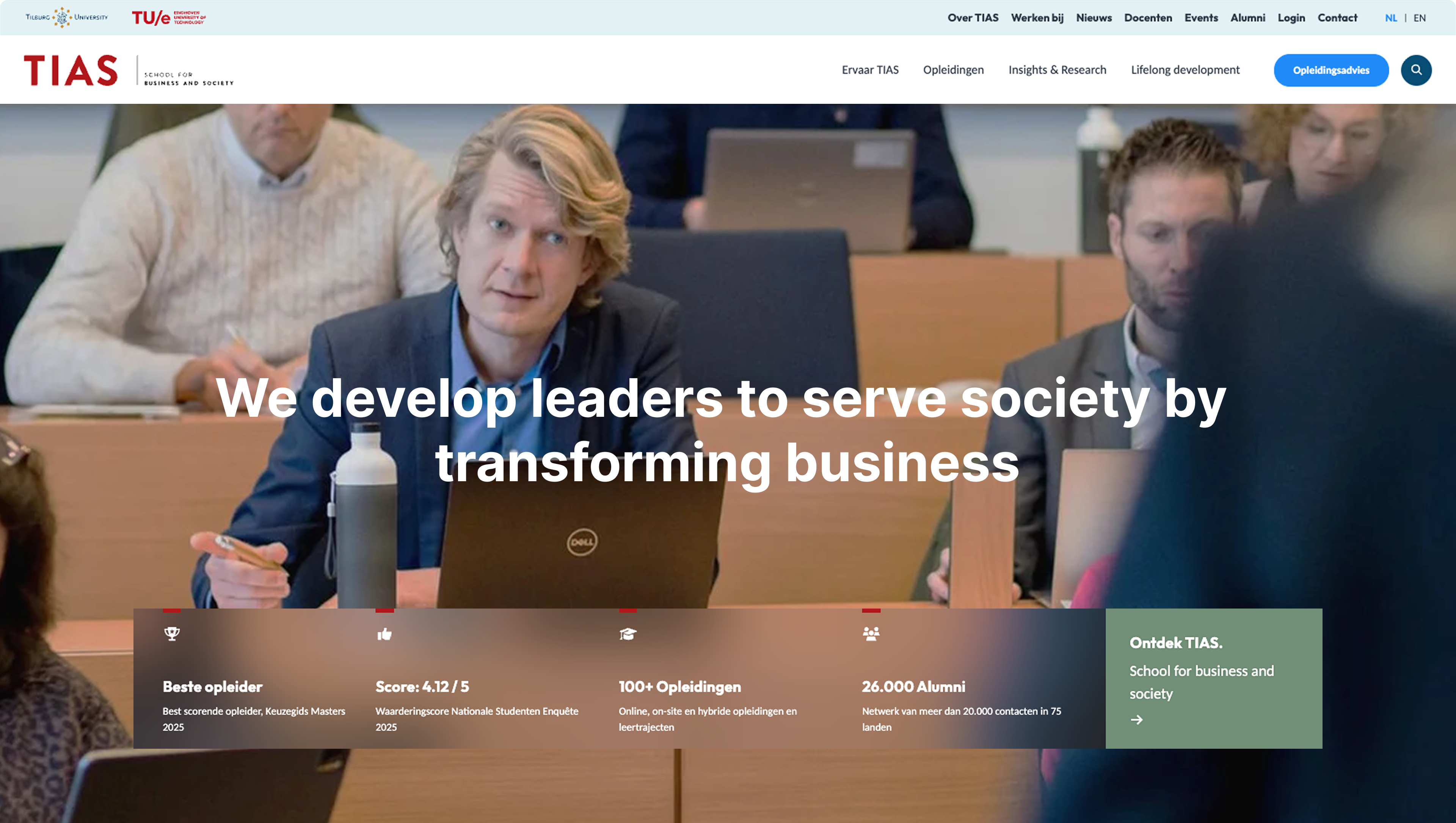 A person with a laptop listens attentively in a classroom. Text overlay reads, "We develop leaders to serve society by transforming business."