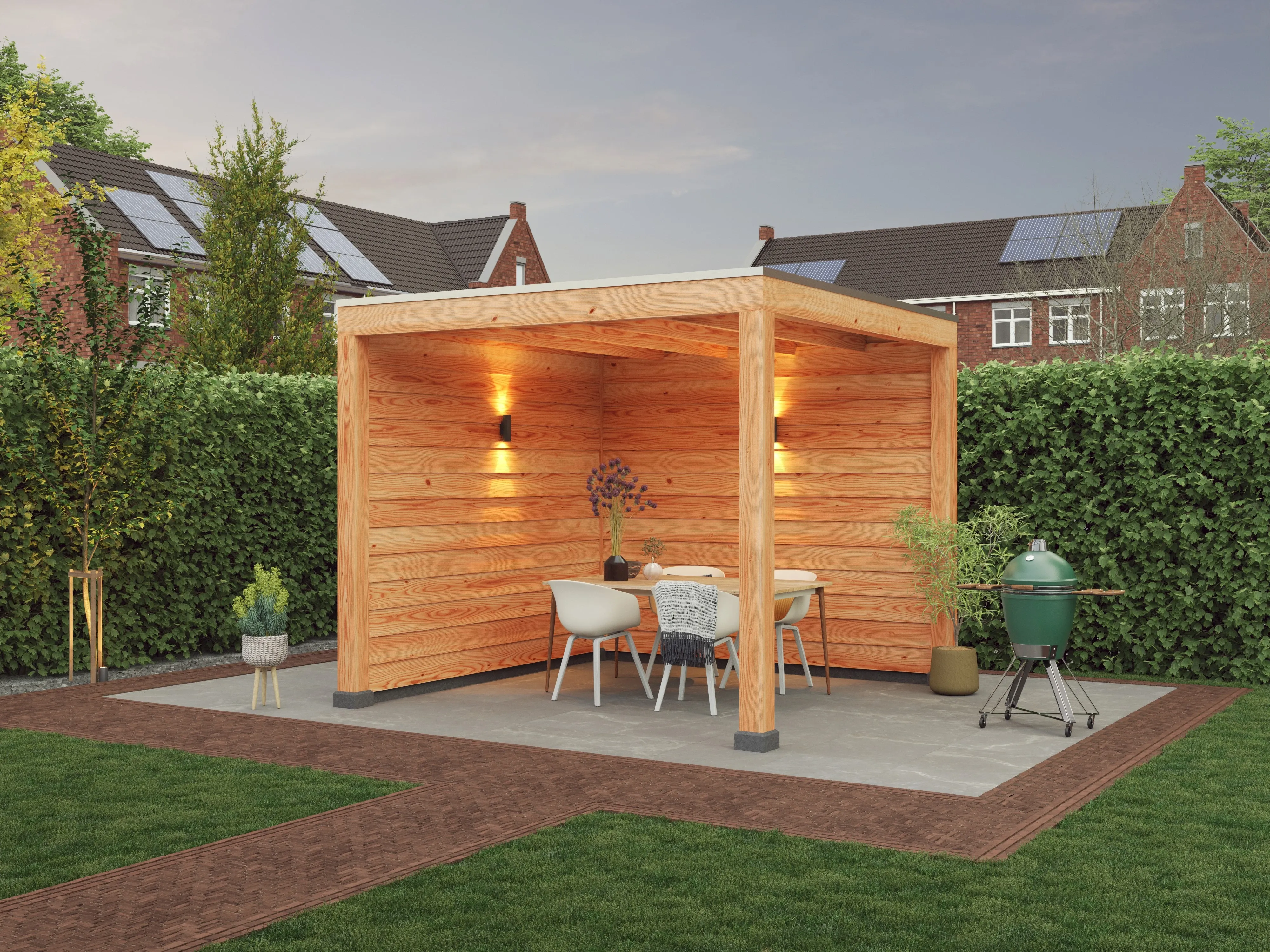 Wooden gazebo on a patio with a table, chairs, and a grill. Surrounded by a hedge, under a cloudy sky with neighboring houses in the background.