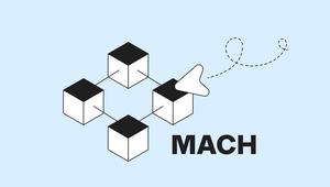 Four connected cubes with a paper plane illustration alongside the word "MACH" on a light blue background.