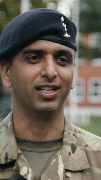Male Reserve soldier of ethnic decent talking to camera