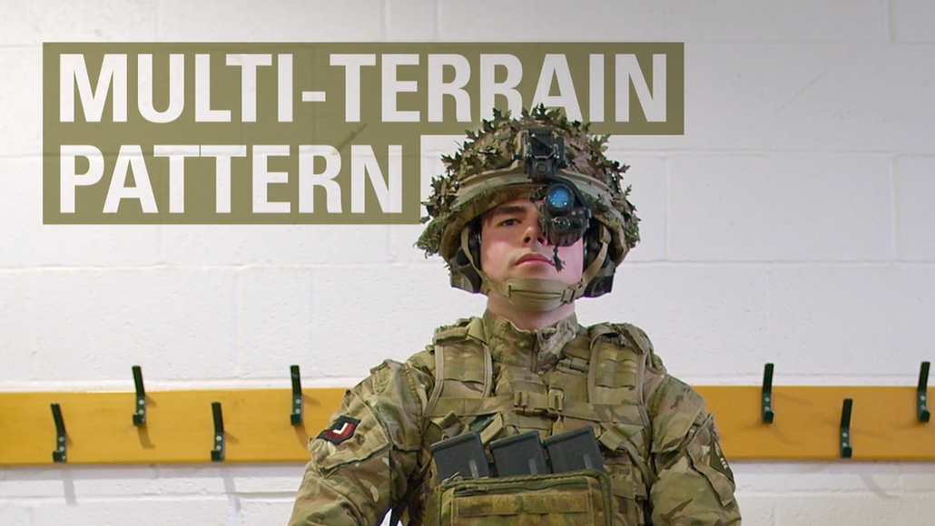Soldier in full camo gear and helmet with words multi-terrain pattern text
