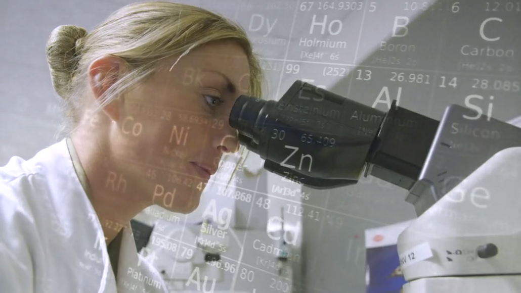 Chemistry video screenshot with a female scientist