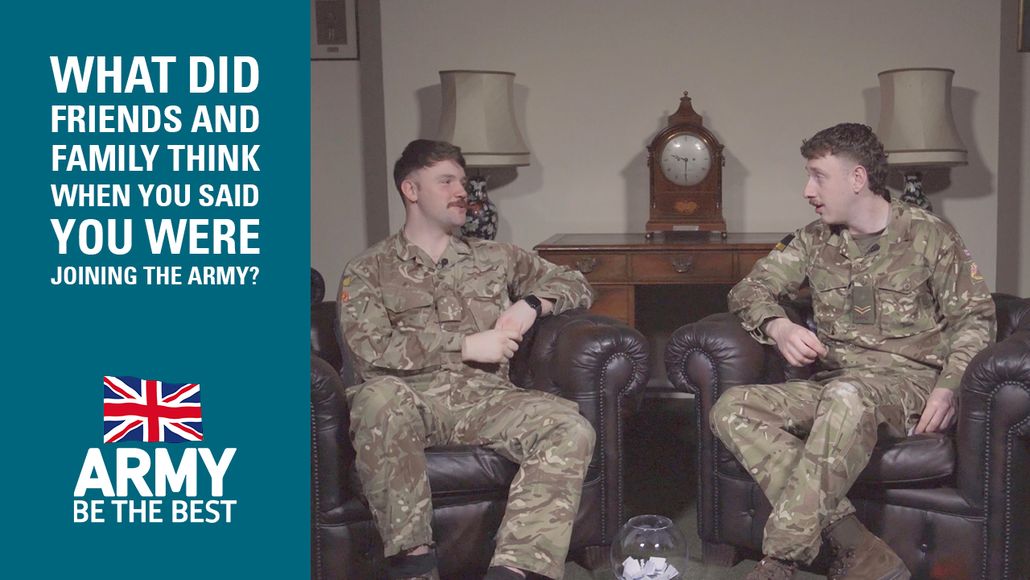 Two soldiers in uniform sit on leather chairs, talking. Text reads, "What did friends and family think when you said you were joining the army?"