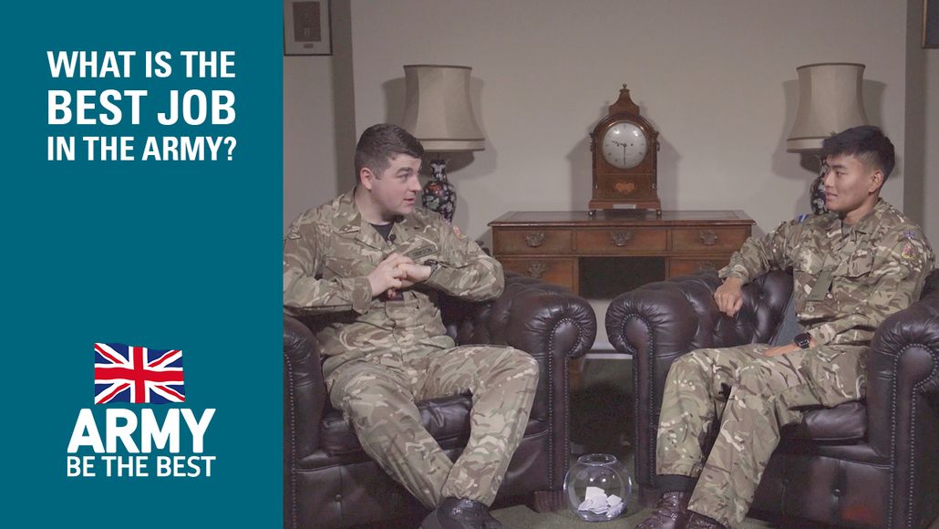 Two soldiers in uniform sit on leather chairs, talking. A sign reads "What is the best job in the army?" with a British flag logo.