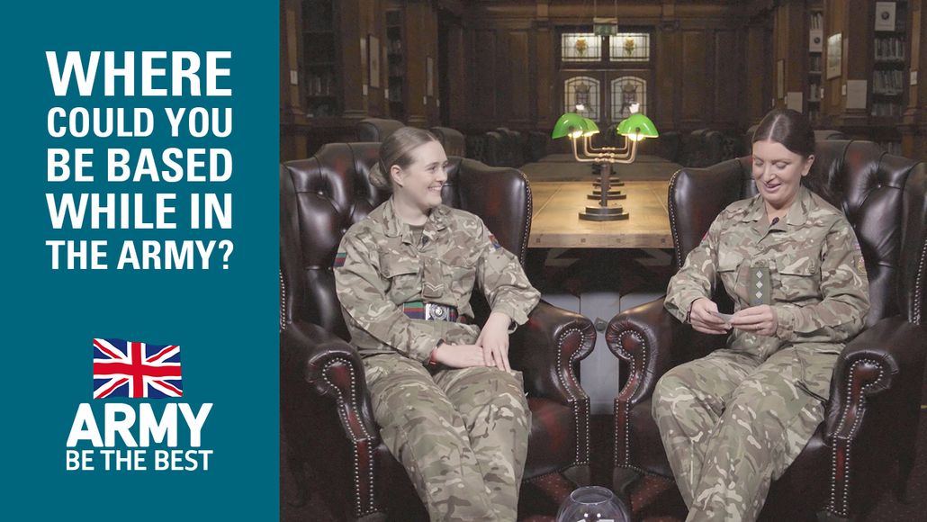 Two soldiers in uniform sit in armchairs, smiling, with a text asking about army base locations on the left side.