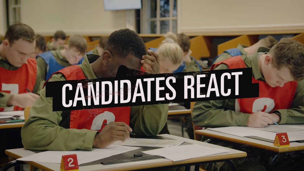 Candidates taking a written assessment with the words candidates react