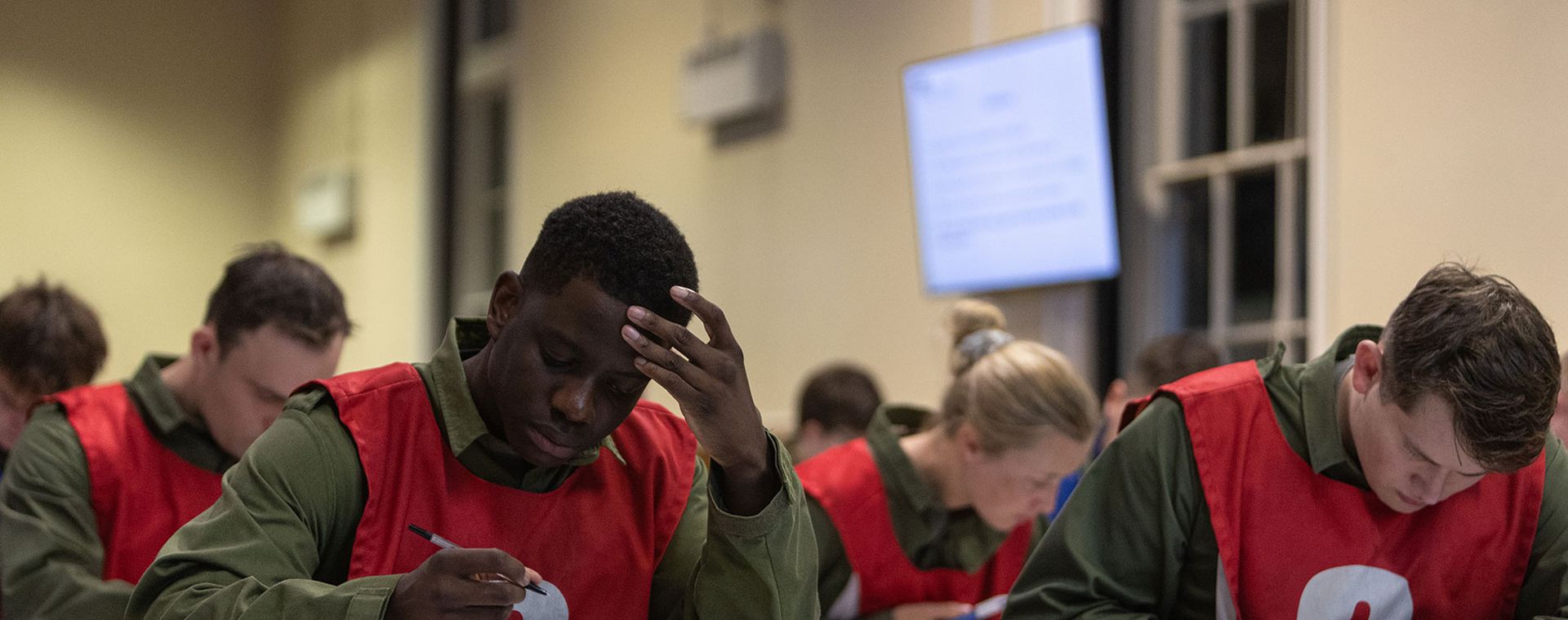 Officer candidates taking a written exam