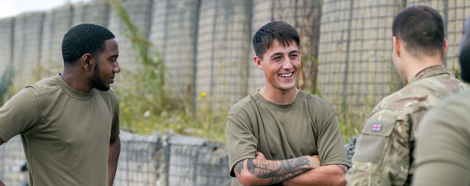 Laughing soldiers relaxing and talking